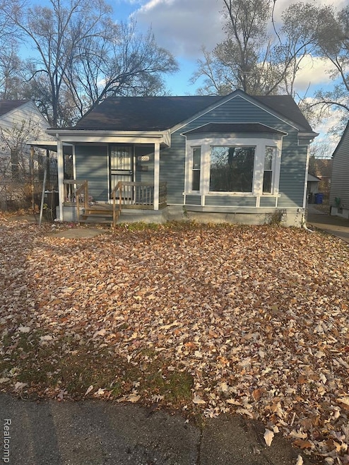 Rear view of house featuring a porch