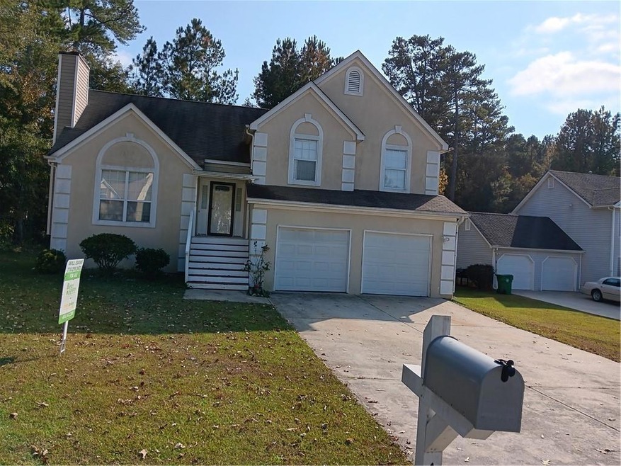 View of front facade featuring concrete driveway, 