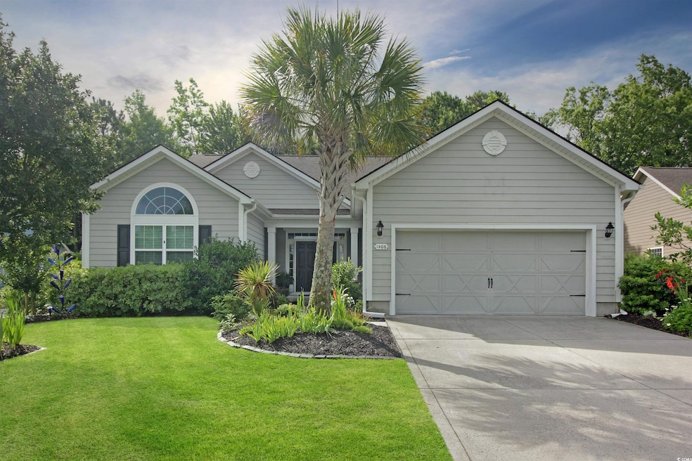 Ranch-style home featuring driveway, a garage, and a front yard
