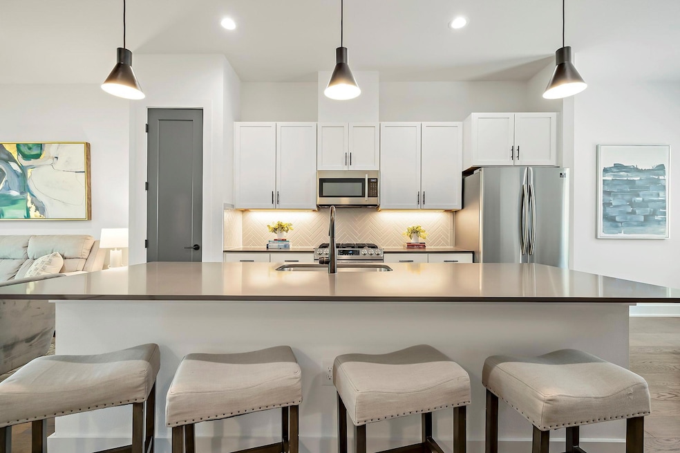 Kitchen with a sink, appliances with stainless st