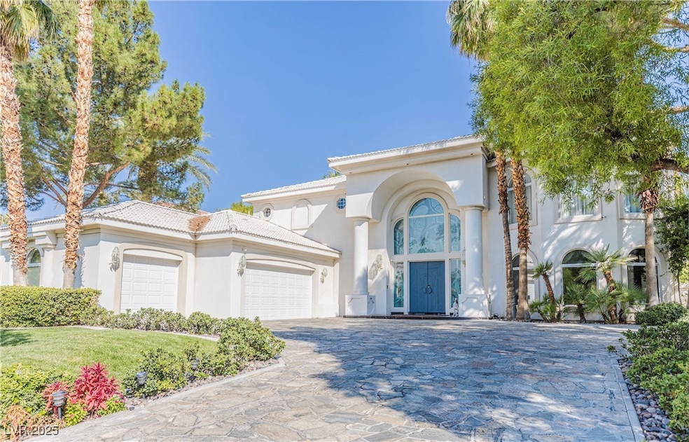 Mediterranean / spanish house featuring a garage,