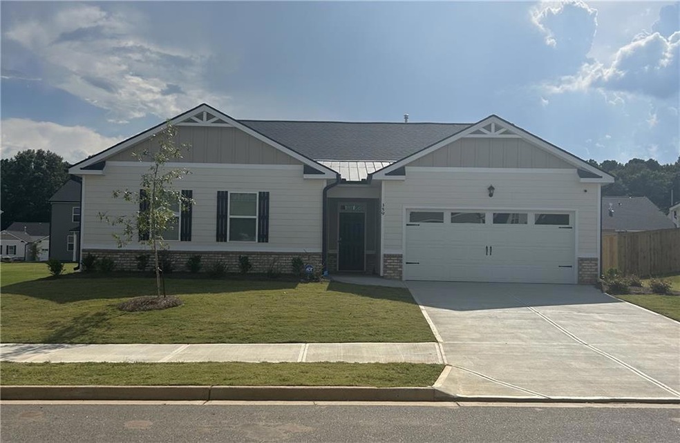 View of front of home featuring a garage and a fro