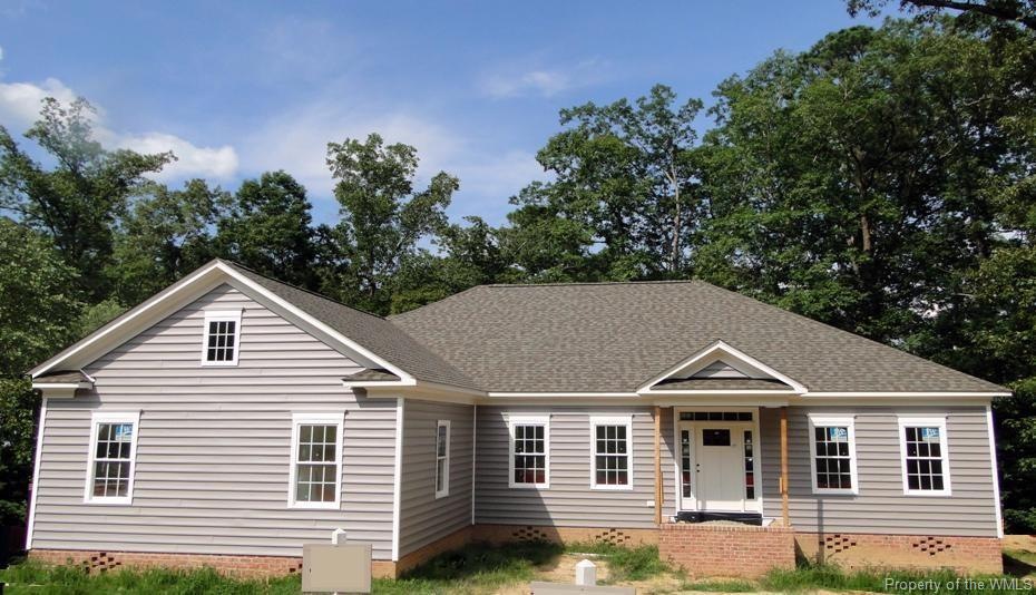 Front View 3524 Splitwood, Custom brick and vinyl siding, insulated crawlspace, open and bright floorplan with ensuite master bathroom. Wide foyer with wainscot, custom trimwork, crown moulding leads to open dining room with wainscot and columns, ope