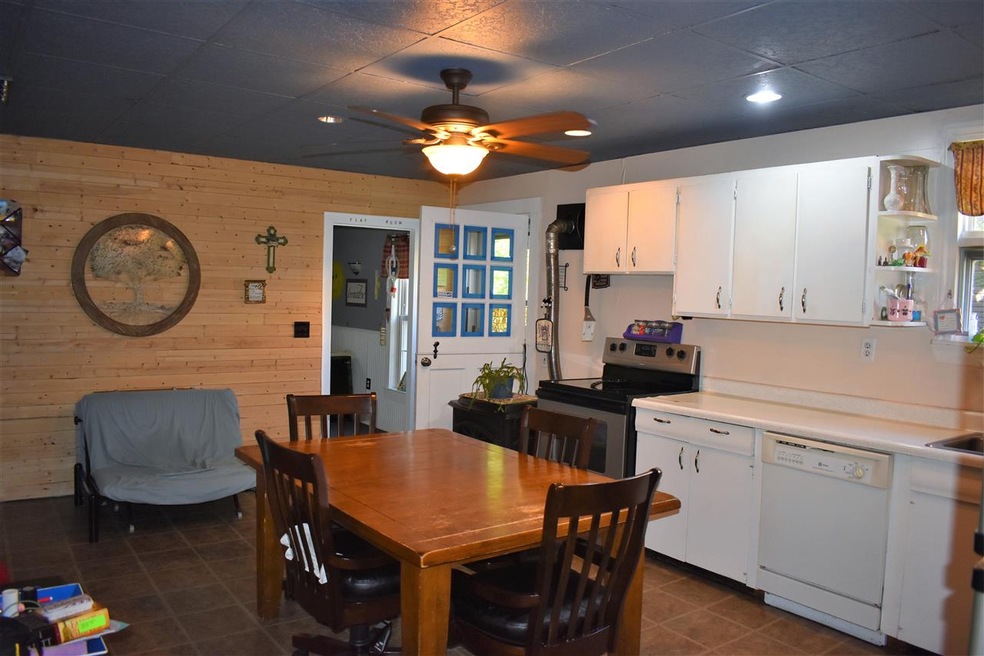 Leads to the back yard or the great covered enclosed 3 season porch.
