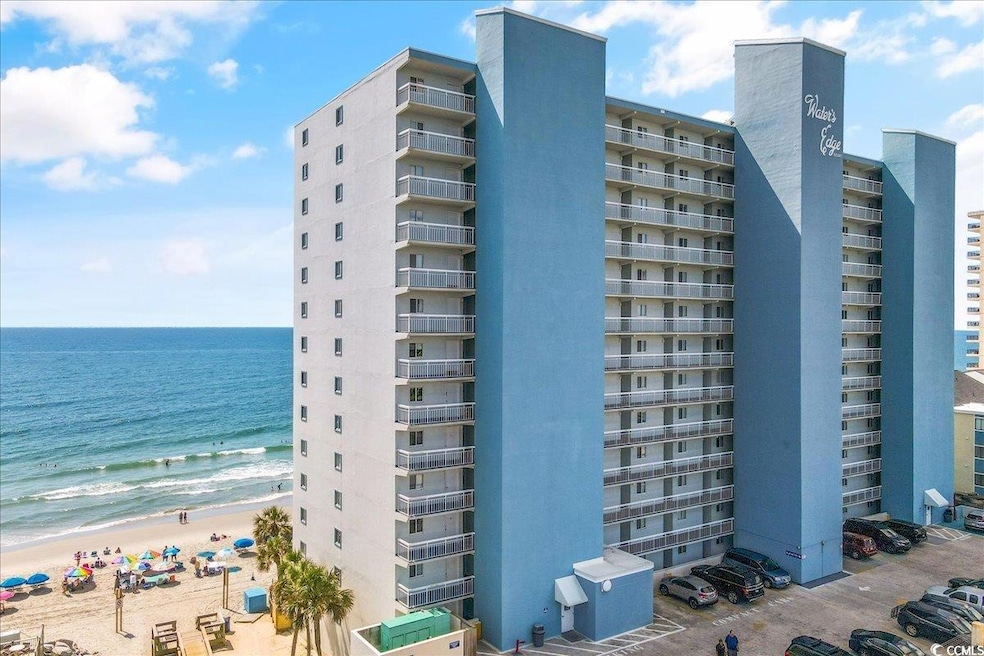 View of building exterior featuring a water view a