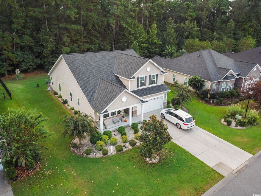 View from above of property with a heavily wooded area