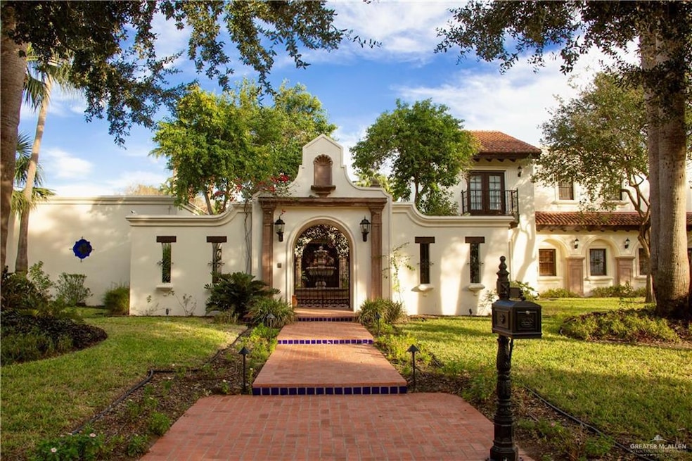 Mediterranean / spanish house featuring a front lawn