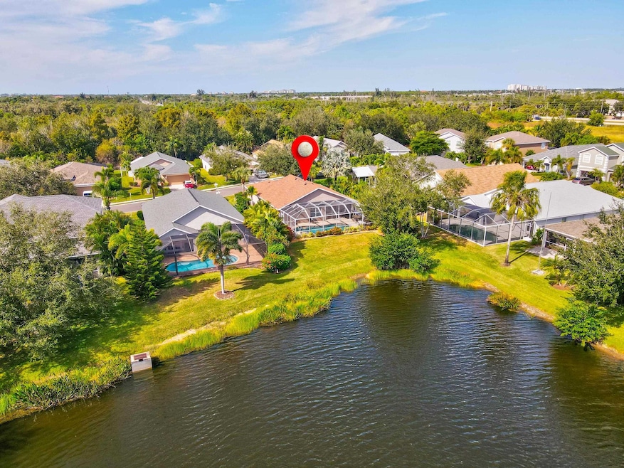 Aerial perspective of suburban area featuring a large body of water