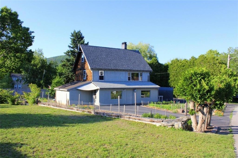 View of house from the side yard,...