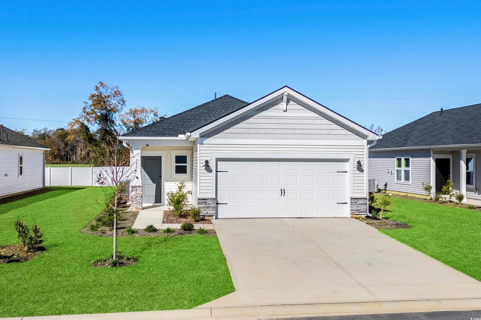 View of front of property with a front yard and a 