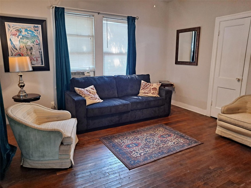 Living area featuring hardwood / wood-style floor