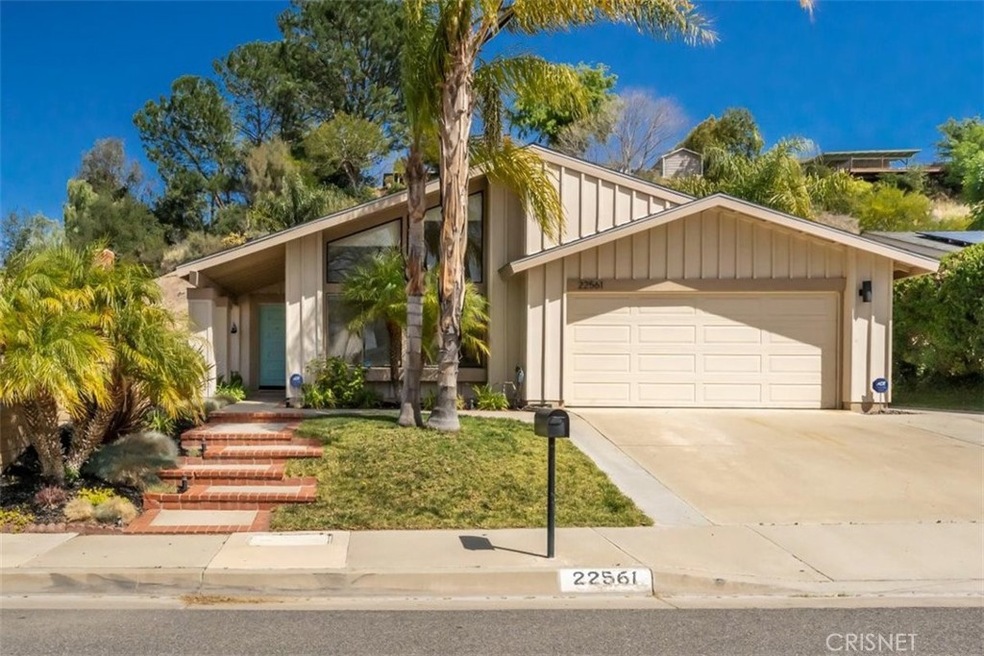 Fresh exterior paint, upgraded fixtures and mature landscape welcome you home