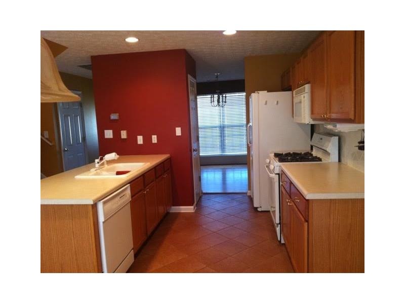 Updated kitchen feature tile flooring, gas stove, 