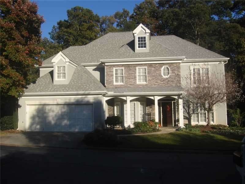 Exterior Front. Charming stucco and stone home for