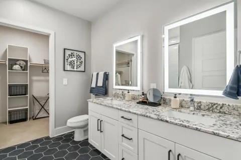 Bathroom featuring tile patterned floors, vanity, 