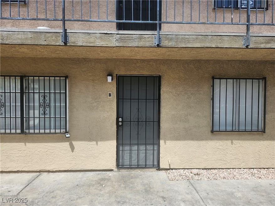 Entrance to property featuring stucco siding