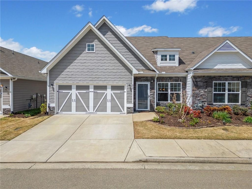 Craftsman house featuring driveway, a garage, and 