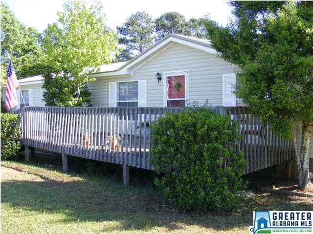 Lovely landscaping and a deck in the front and the
