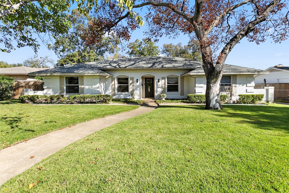 Ranch-style house with brick siding
