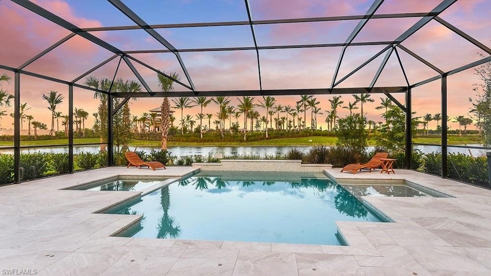 Outdoor pool featuring a patio area, a water view, and glass enclosure