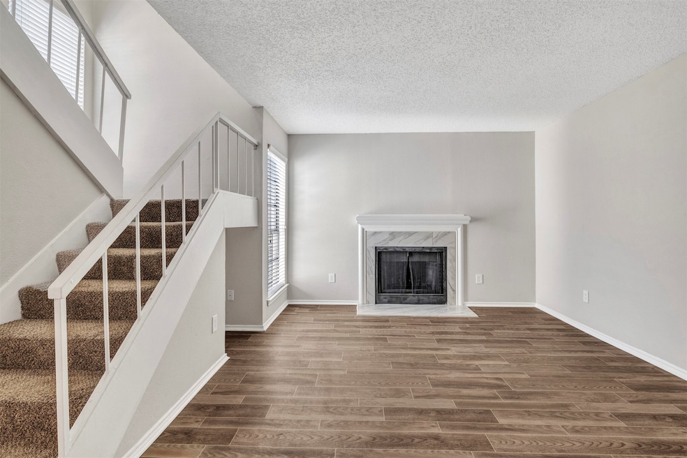 Living area with FP and vinyl plank flooring