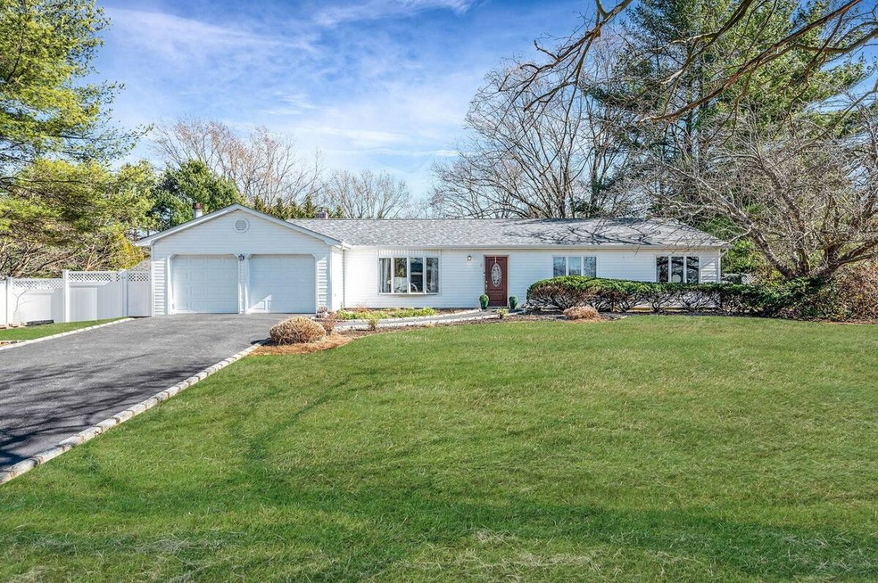 Ranch-style house featuring driveway, an attached 