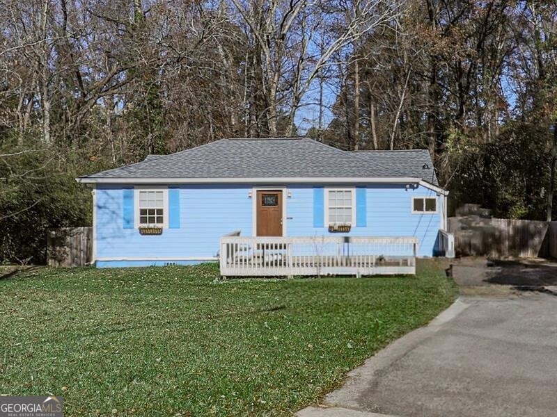 View of front of home featuring a deck and a front