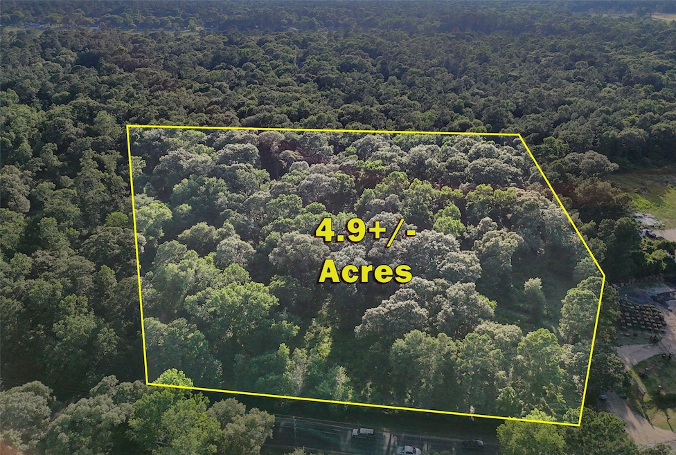 Aerial view of the 4.9+/- unrestricted acres locat