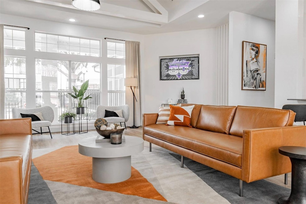 Living room with light hardwood / wood-style floor