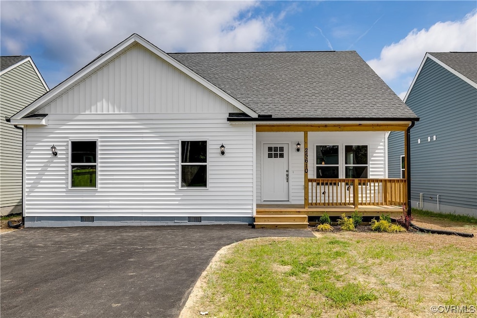 View of front of home featuring crawl space, cover