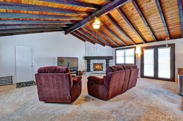 Huge family room w/ rock fireplace & vaulted ceilings!