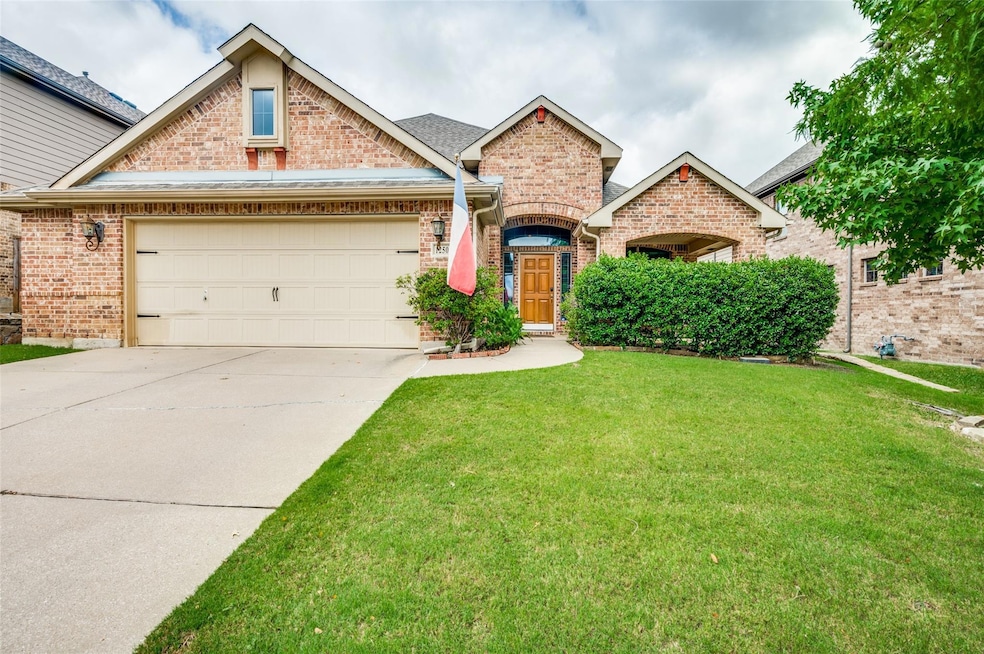 View of front of property with a garage and a fron