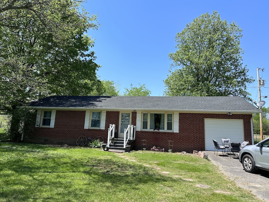 Front of home. Garage has been converted to a den.