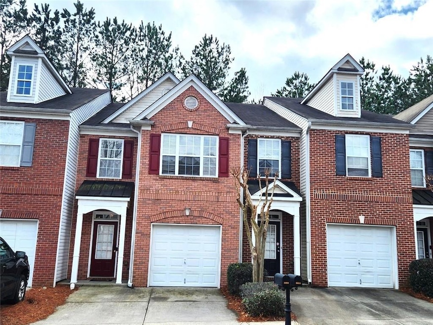 View of property with a garage