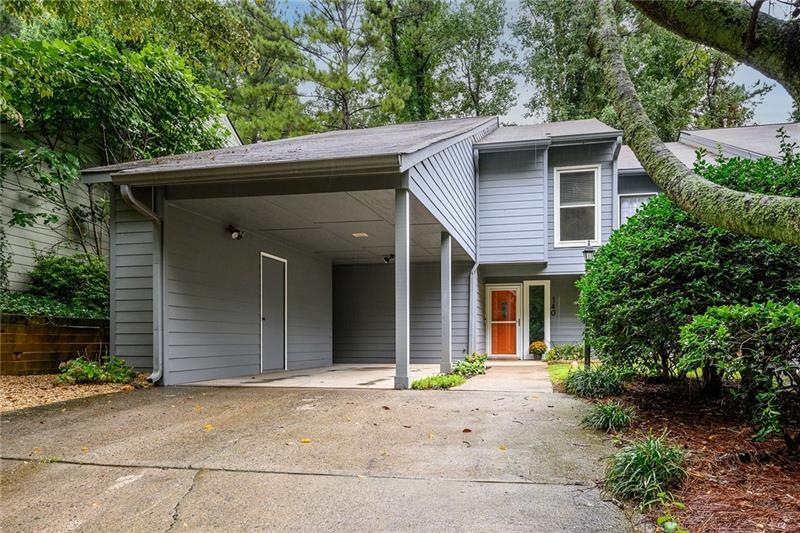 END unit townhome with carport and storage overhea