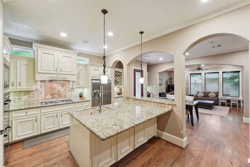 Kitchen opens to the main living and dining areas,