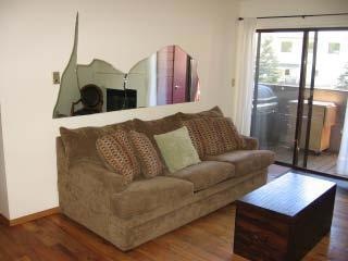 Living room with designer mirror in wall