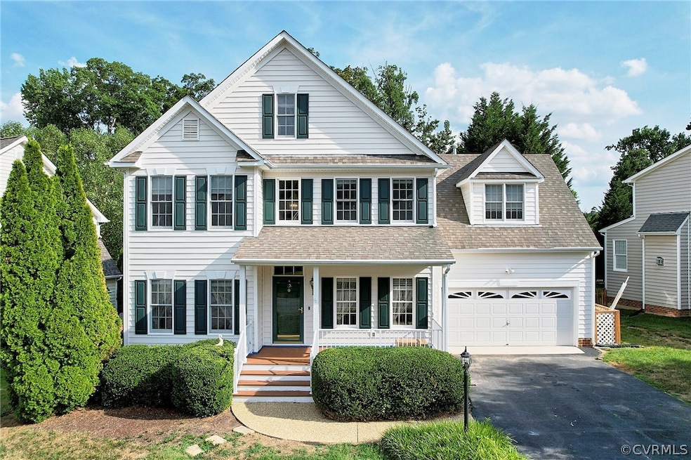 View of front facade featuring a garage