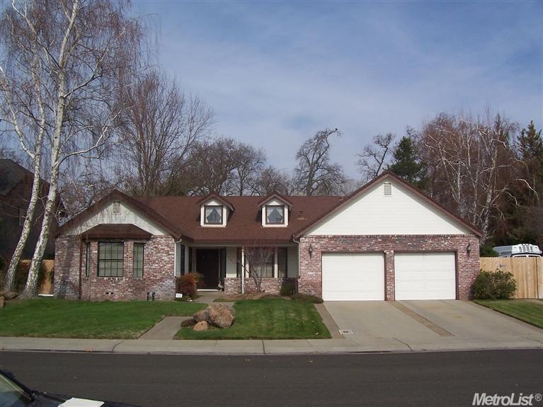 Front of home showing RV parking.