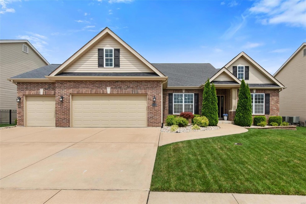 Gorgeous curb appeal in this ranch home with a 3-car garage and professionally landscaped, irrigated, level yard!