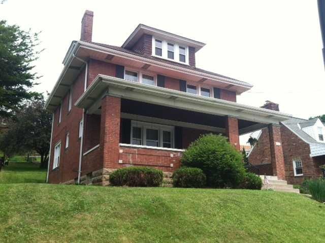 Exterior Front. solid brick all new windows