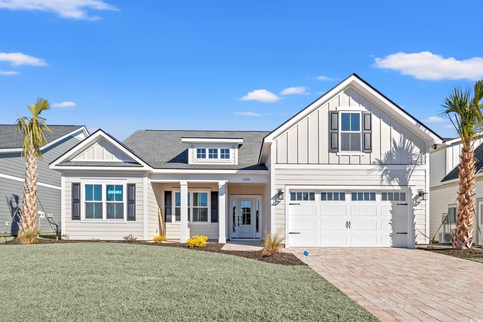 View of front of home featuring a garage and a fro