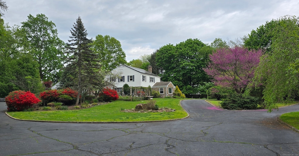 Stone wall entry leads to the circular driveway...