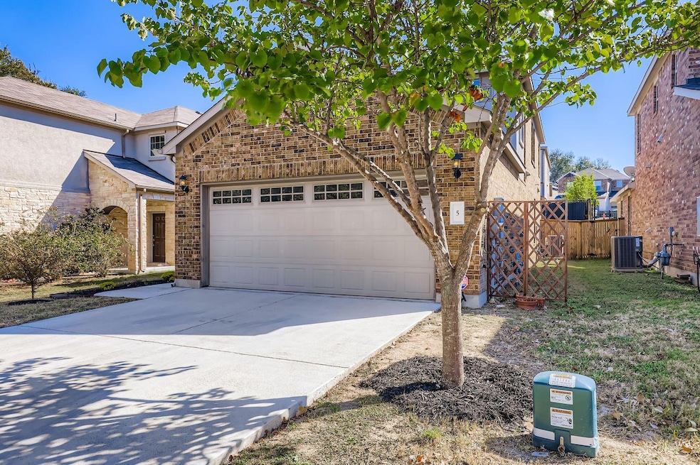 View of front of home featuring brick siding and driveway