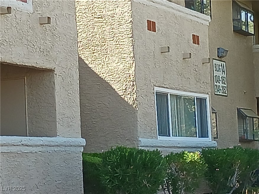 Front of condo, front door is just in side the walk way on the right.