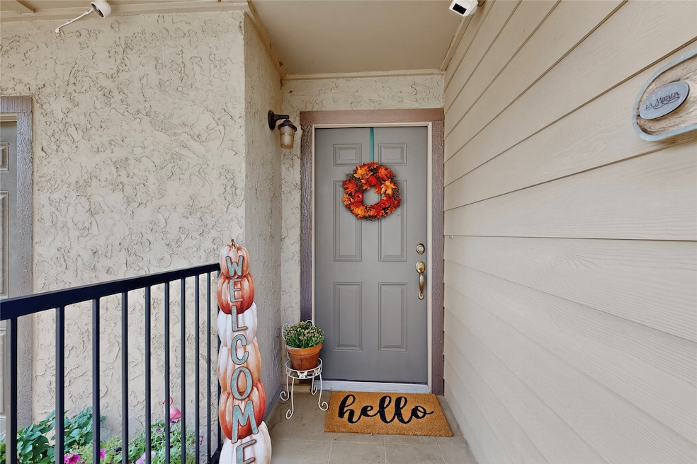 View of exterior entry featuring stucco siding