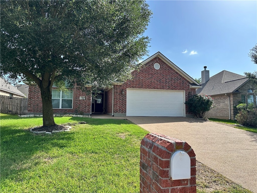 View of front of property featuring an attached ga