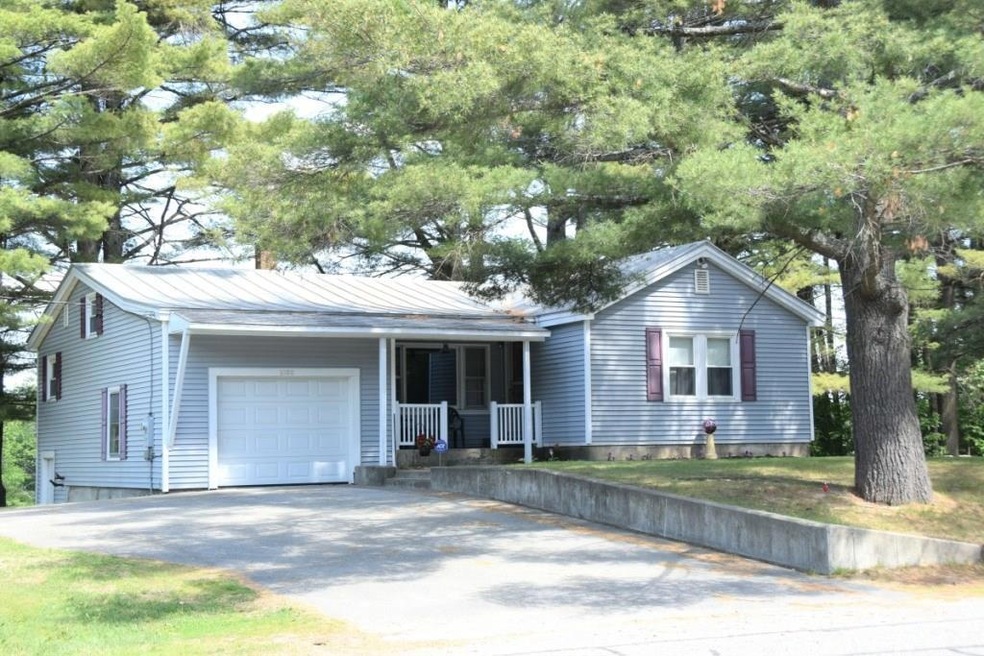 Front of home with paved driveway