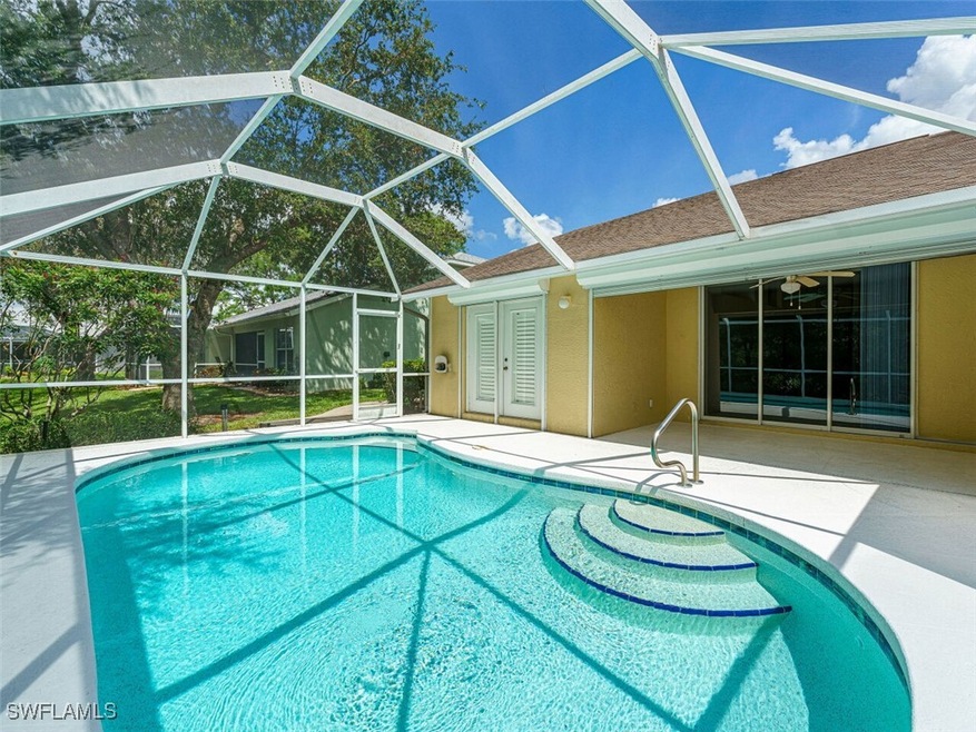 View of your swimming pool featuring glass enclosu