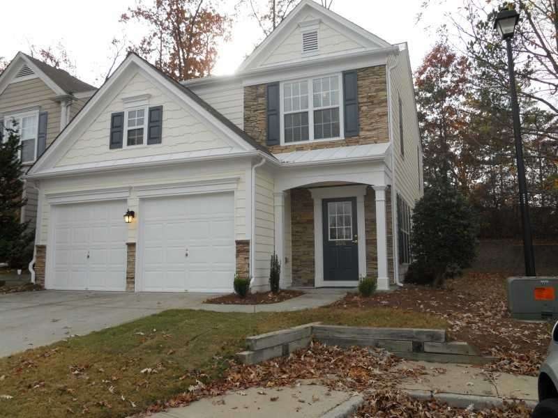 Exterior Front. Peaceful end-unit nestled in a quiet cul-de-sac in Delightful Duluth. Easy access to I-85.
